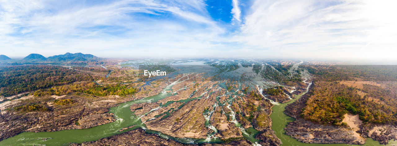 Aerial view of landscape against cloudy sky