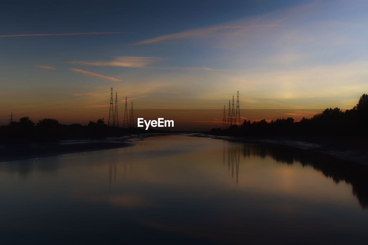 VIEW OF RIVER AT SUNSET