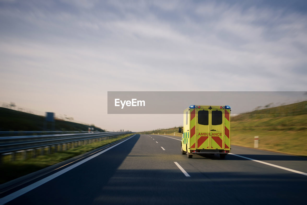 Fast moving ambulance car of emergency medical service on highway. 