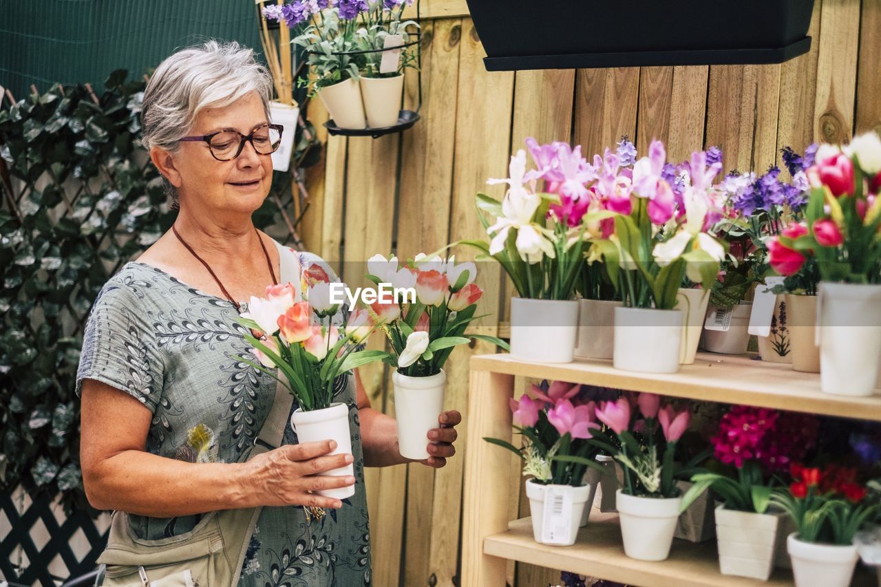 Midsection of woman holding flower bouquet