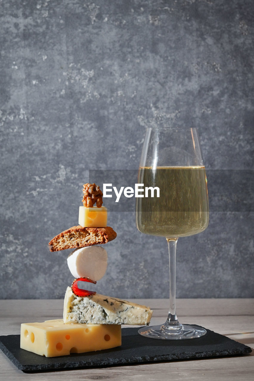 Concept equilibrium floating food and white wine glass