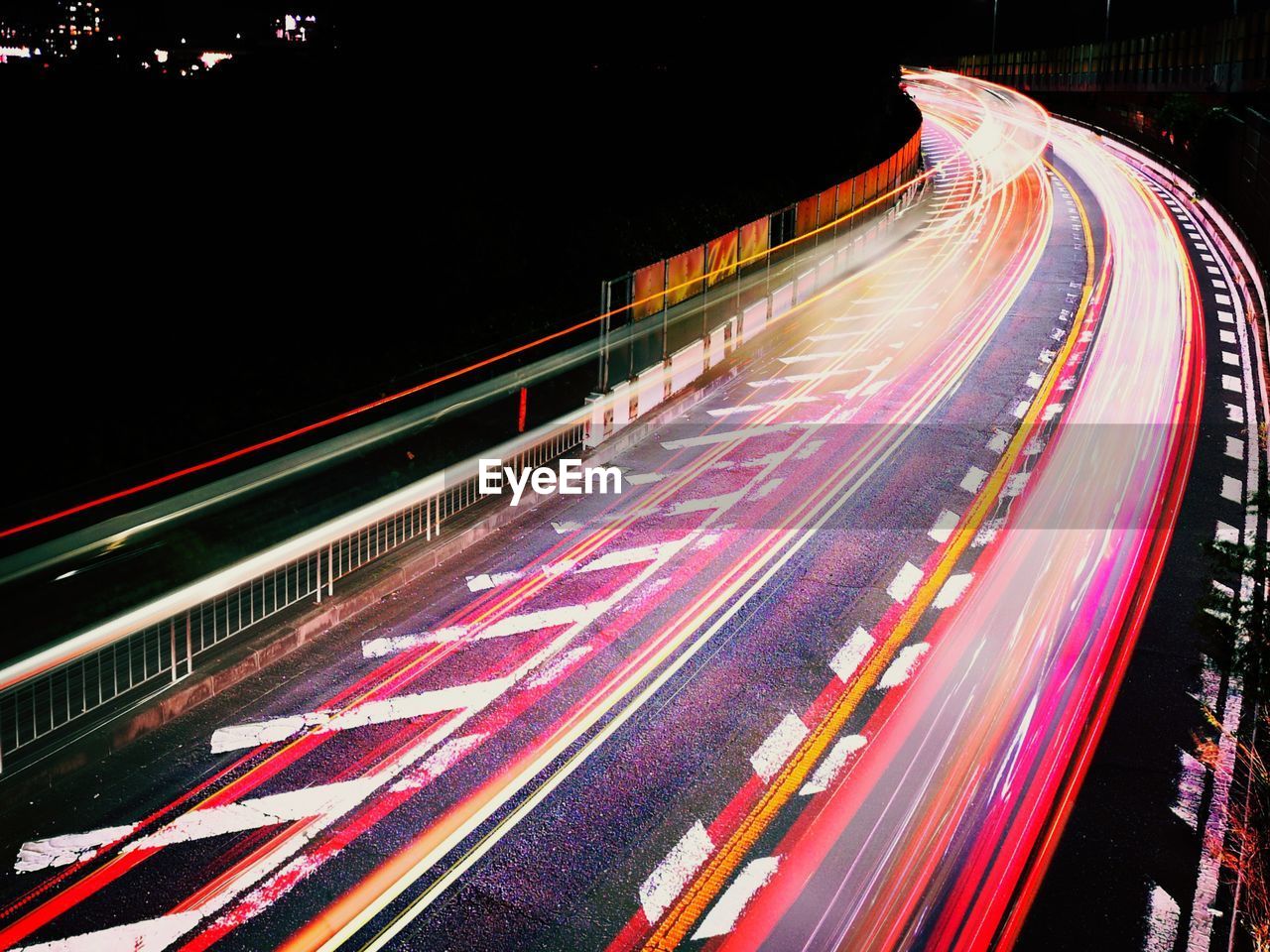 High angle view of light trails on road at night