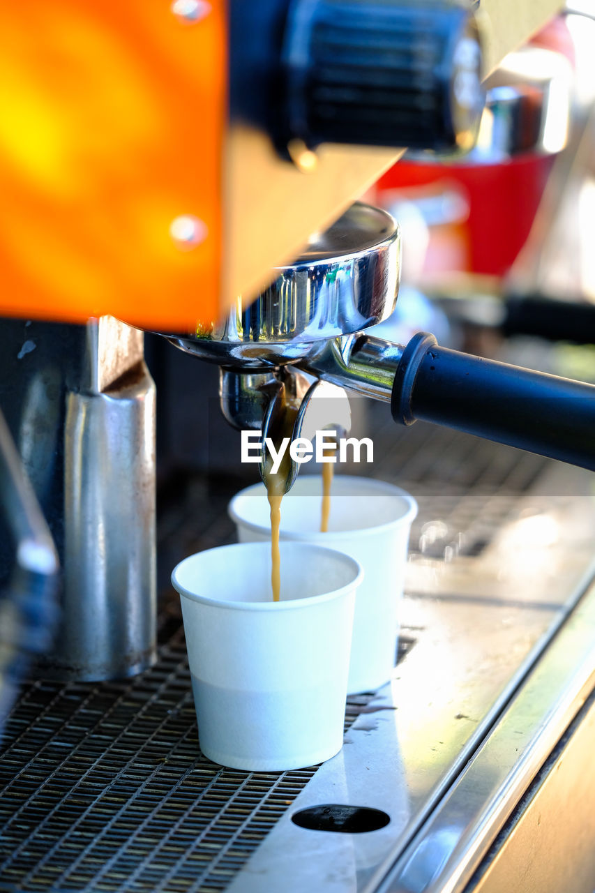 CLOSE-UP OF COFFEE CUP ON TABLE