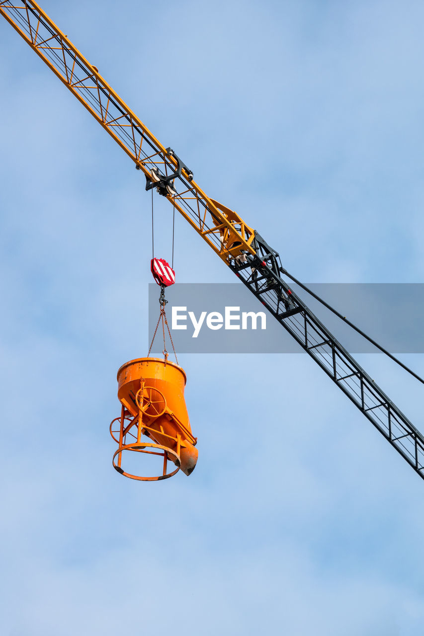 LOW ANGLE VIEW OF CRANE AT CONSTRUCTION SITE