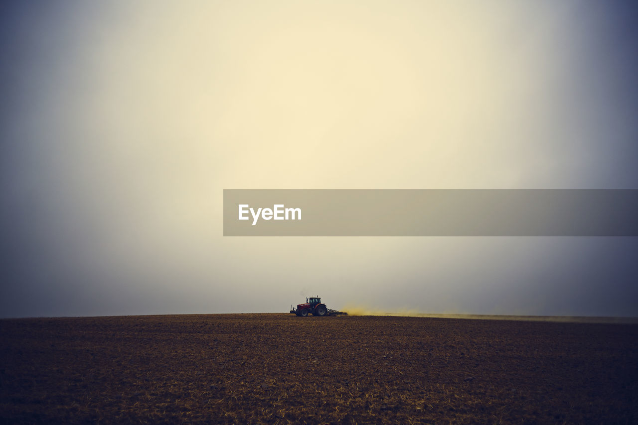 SCENIC VIEW OF LAND AGAINST SKY DURING SUNSET