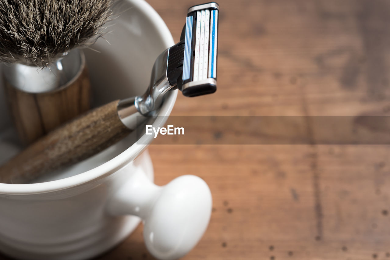 High angle view of shaving equipment on table
