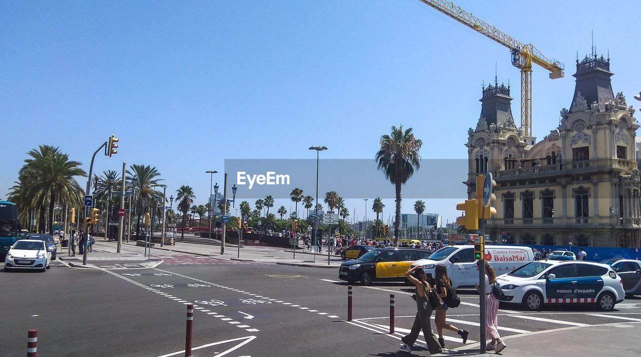 View of barcelona city street against clear sky 