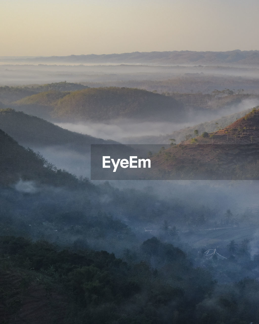 HIGH ANGLE VIEW OF FOG OVER LANDSCAPE