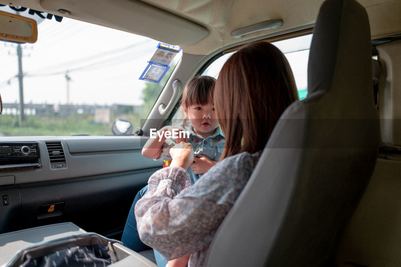 GIRL SITTING IN BUS