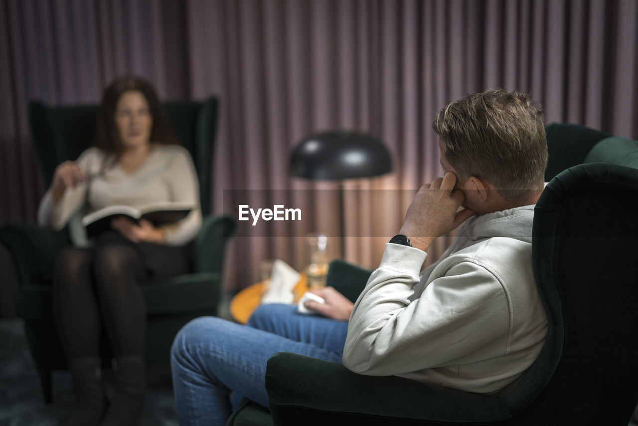 Male patient and female doctor at therapy session