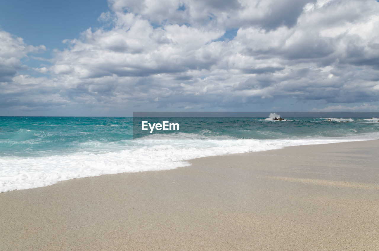 Scenic view of beach against sky