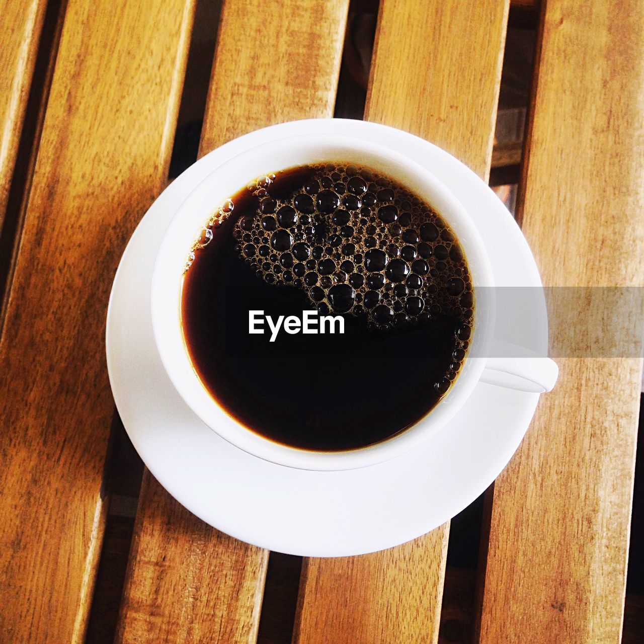 Close-up of black coffee served on table
