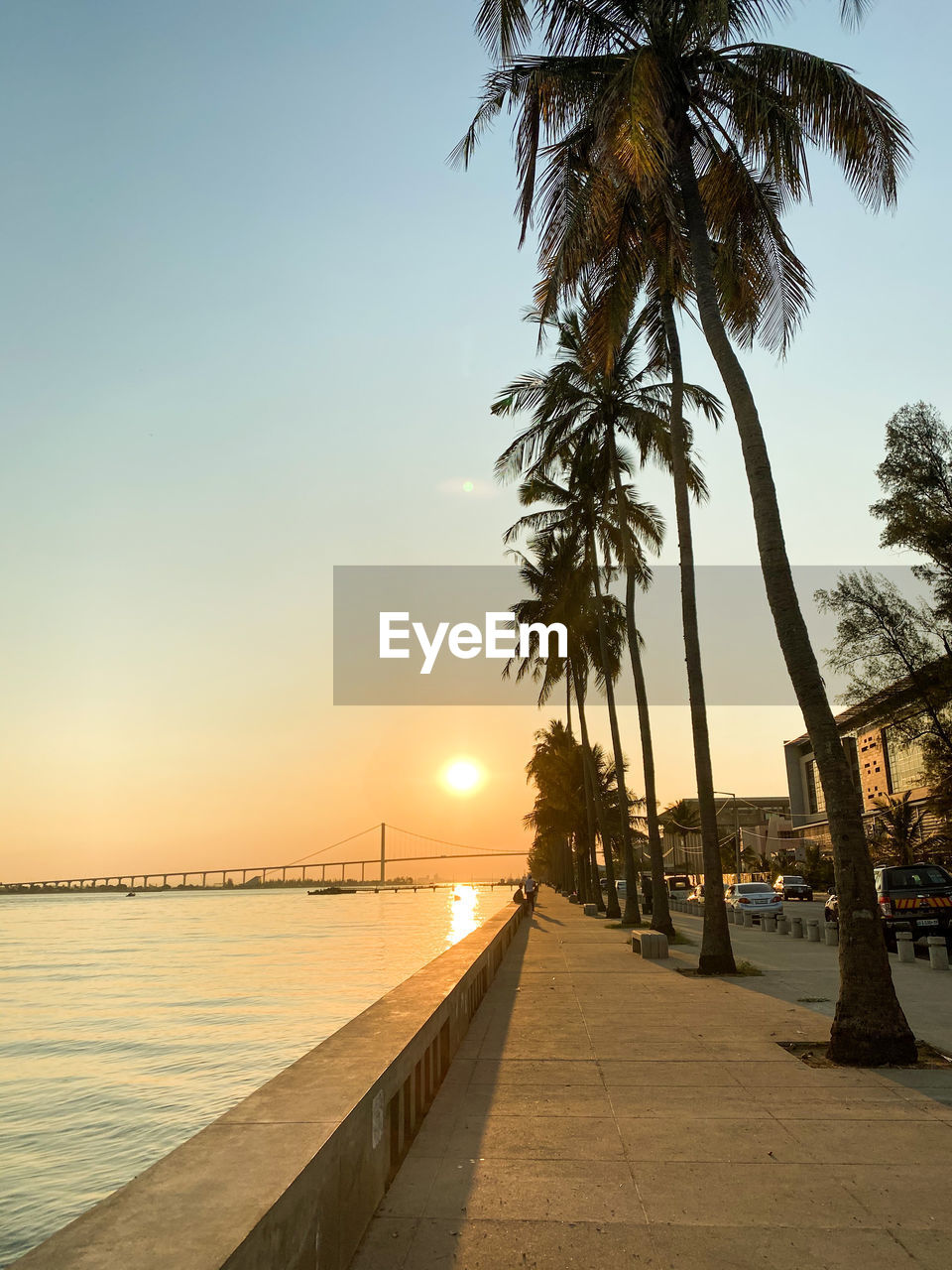 Scenic view of sea against clear sky at sunset