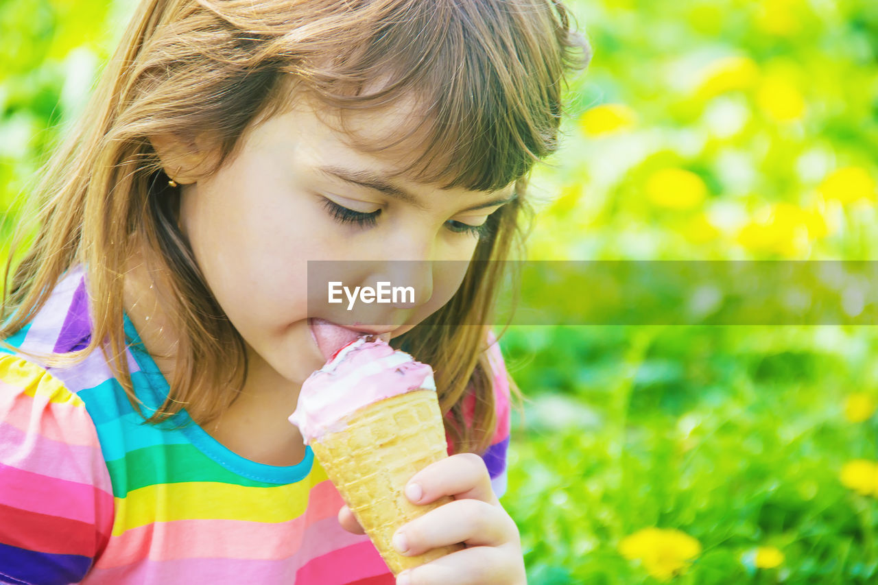 close-up of girl blowing ice cream