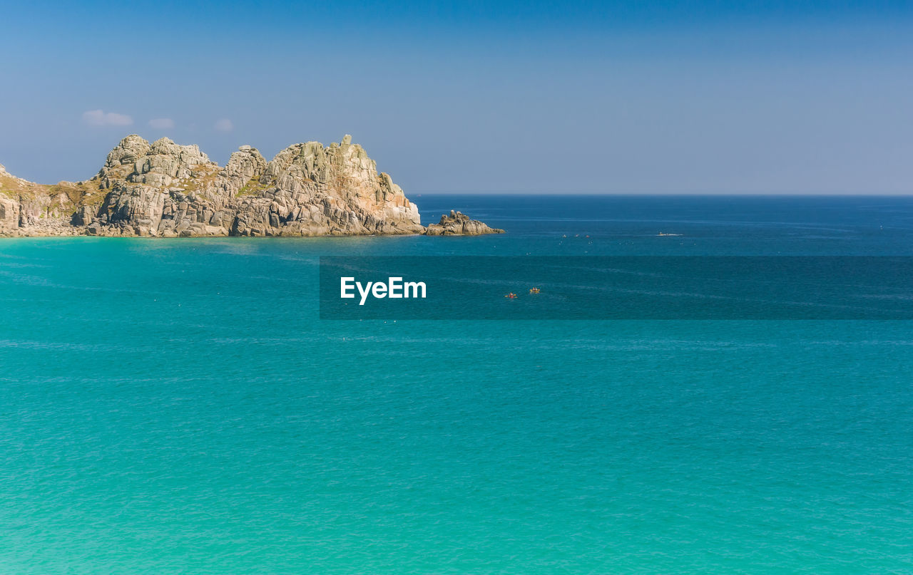 Scenic view of sea against blue sky