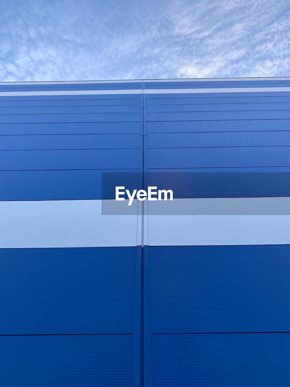 CLOSE-UP OF BUILDING AGAINST BLUE SKY