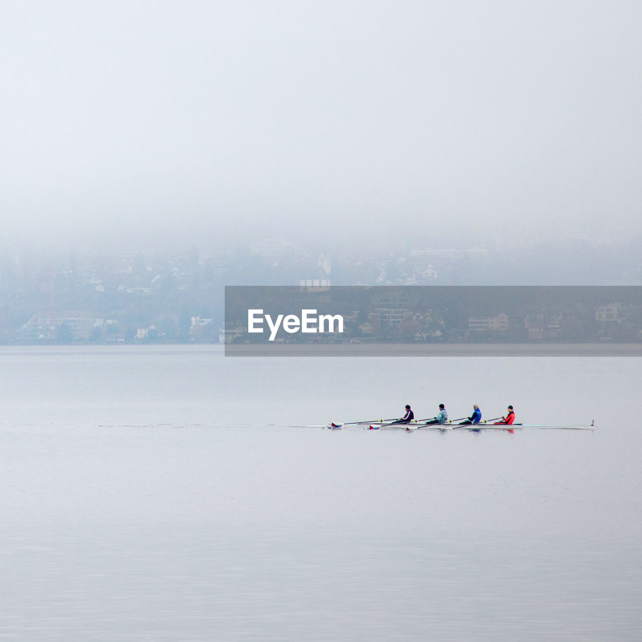 Rowing lake zurich on foggy morning.