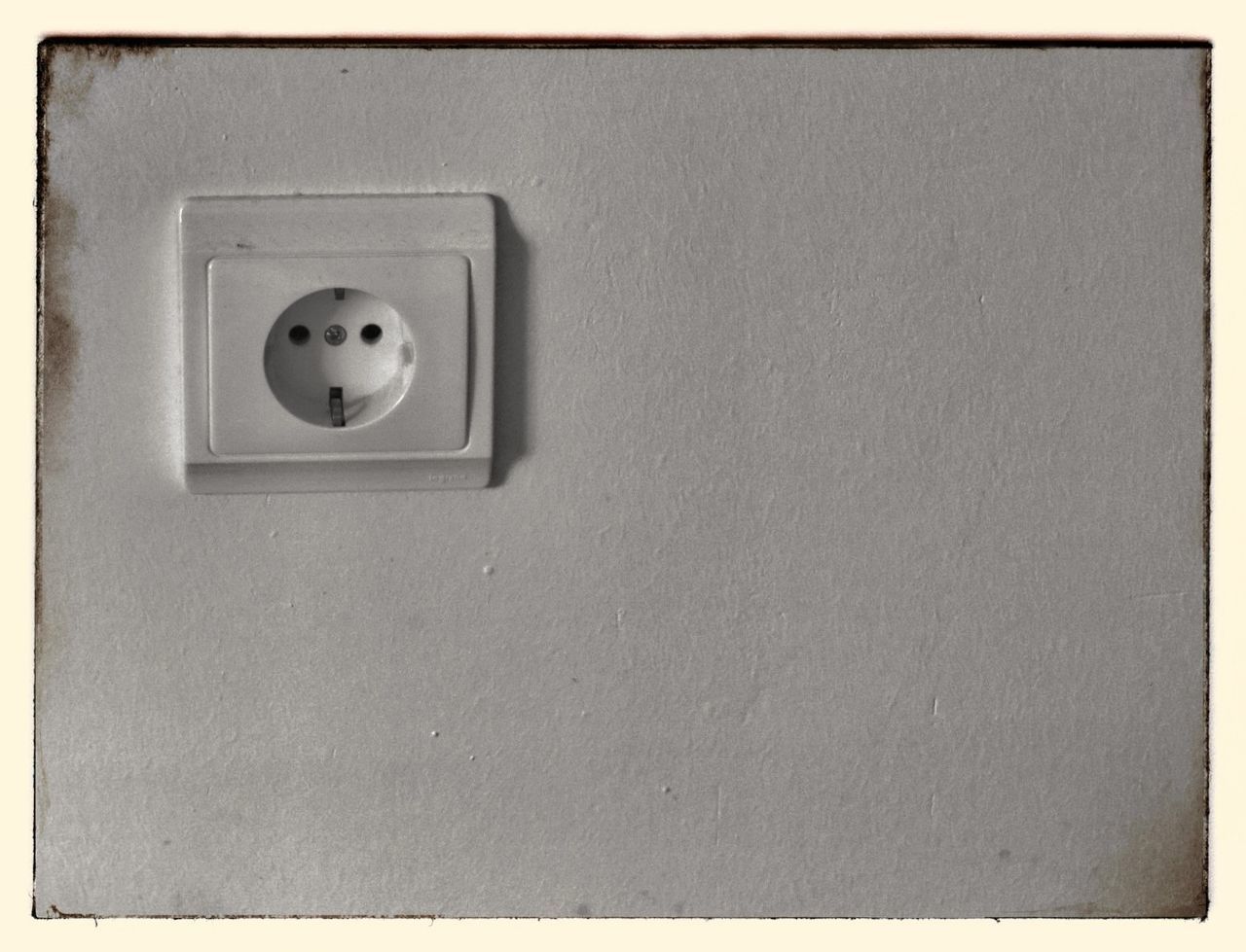 Close-up of electrical socket on white wall