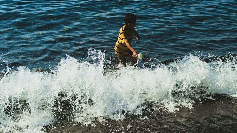 WAVES SPLASHING ON ROCKS