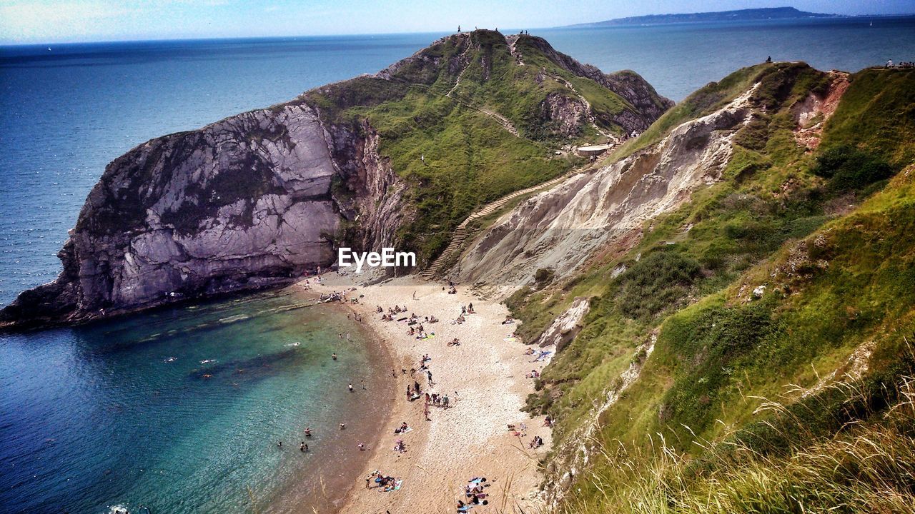 People relaxing on beach