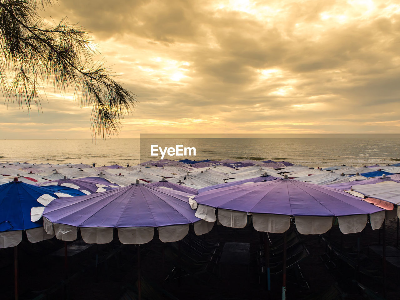 Large umbrella crowded along cha-am beach