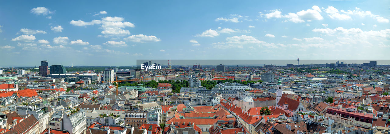 HIGH ANGLE VIEW OF BUILDINGS AGAINST SKY