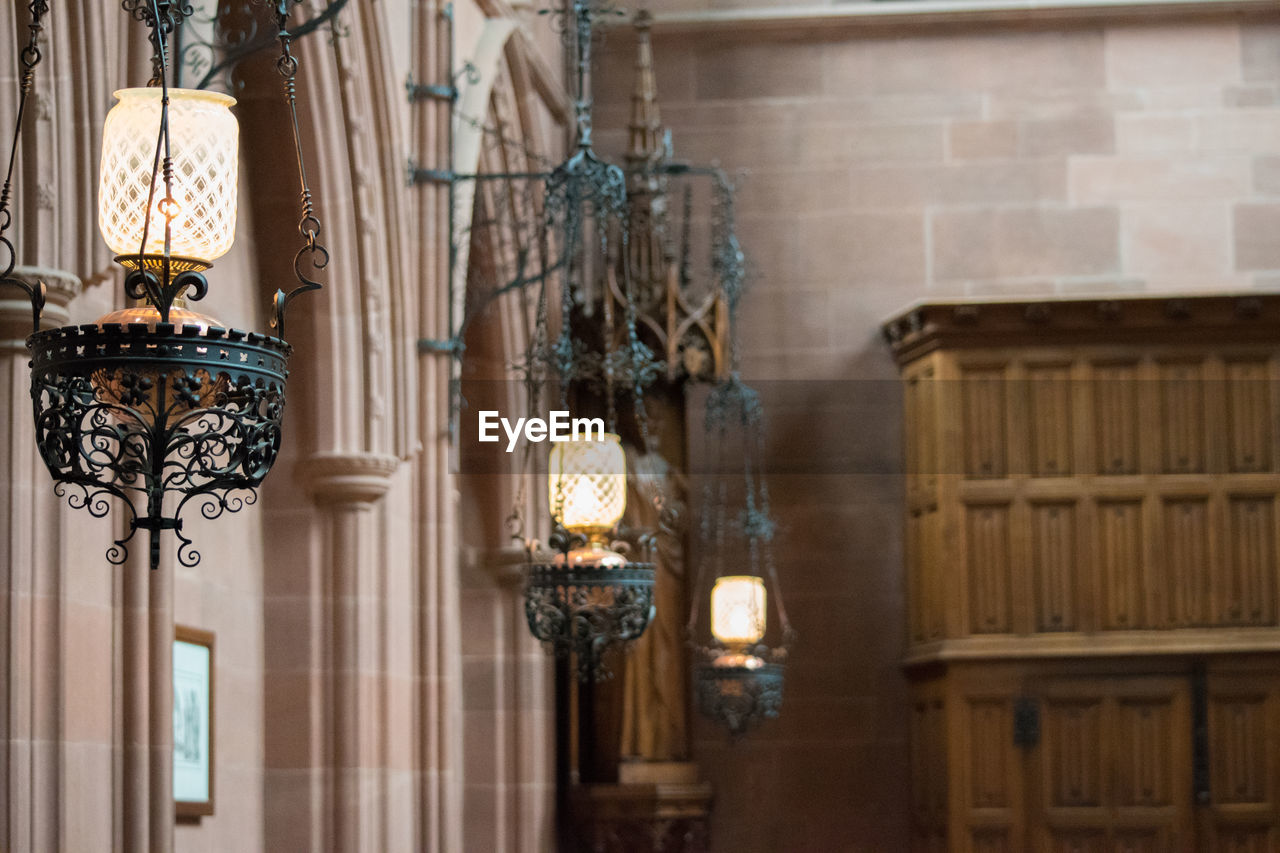 Lanterns hanging in historic building