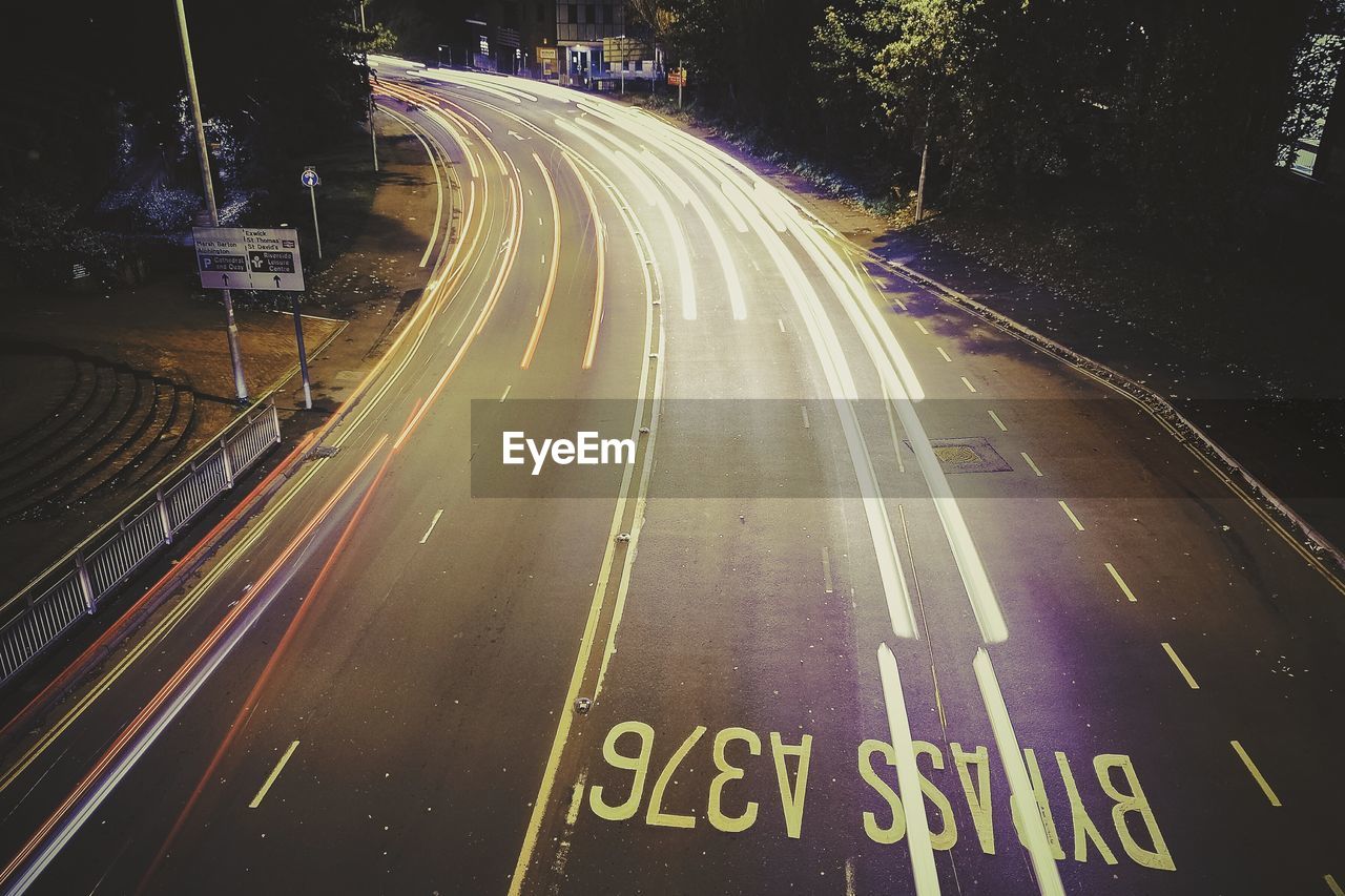 High angle view of light trails on road at night