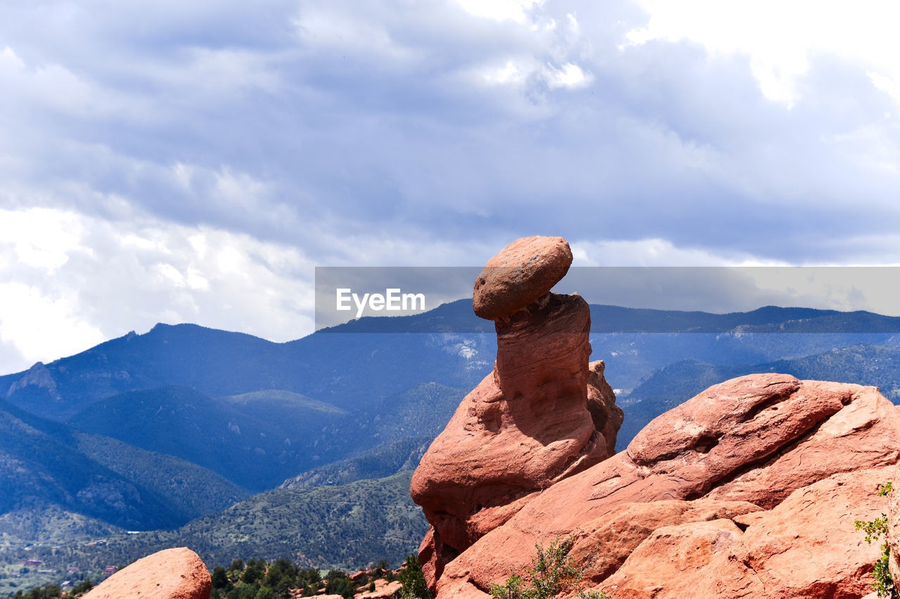 View of rock against cloudy sky