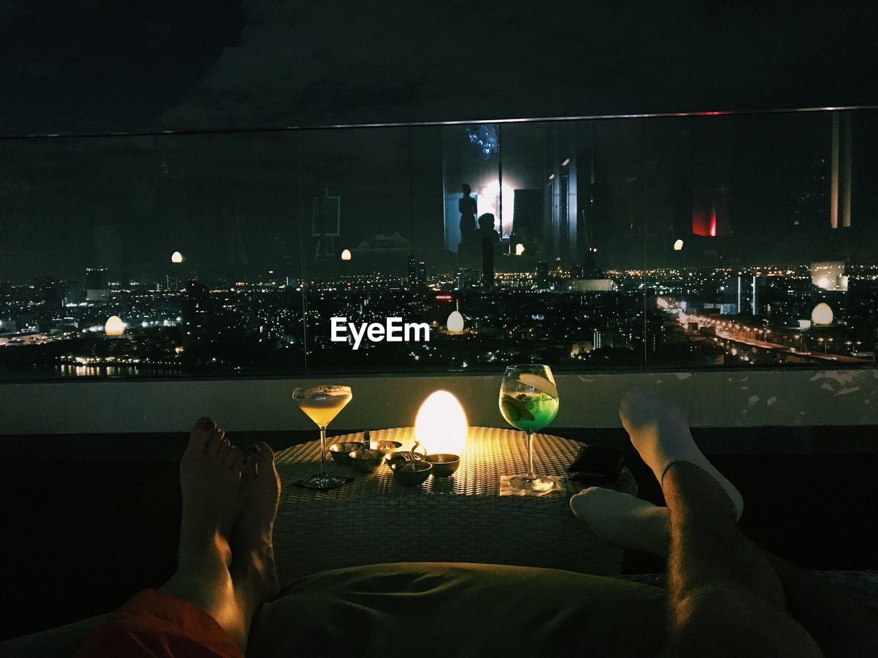 LOW SECTION OF PEOPLE ON ILLUMINATED BUILDING