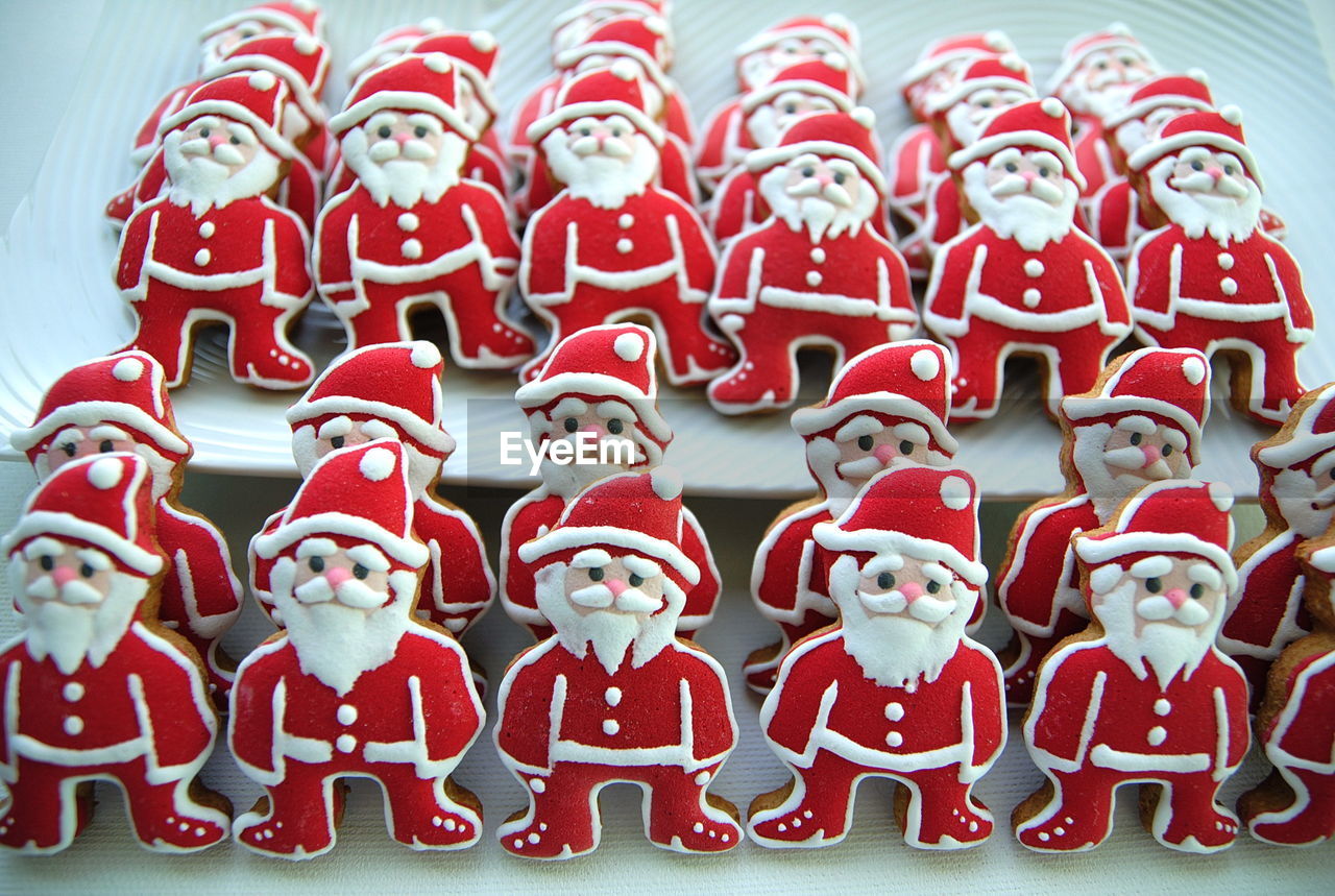 Close-up of santa claus shaped cookies on table
