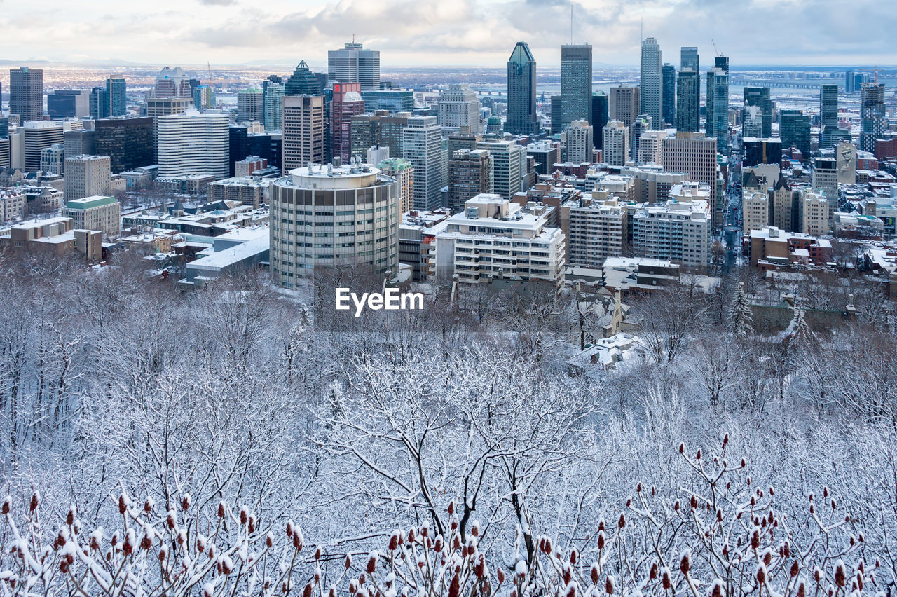 Aerial view of buildings in city during winter