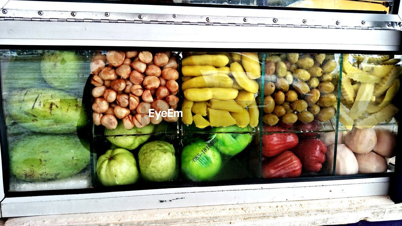 CLOSE-UP OF FRUITS AND VEGETABLES IN CONTAINER