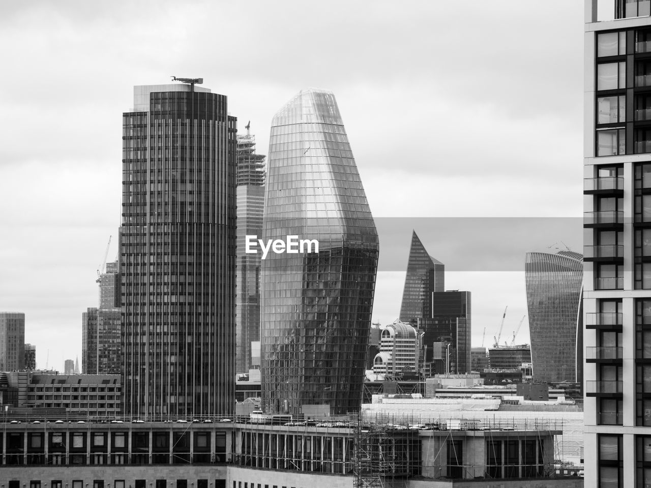 Modern buildings in city against sky