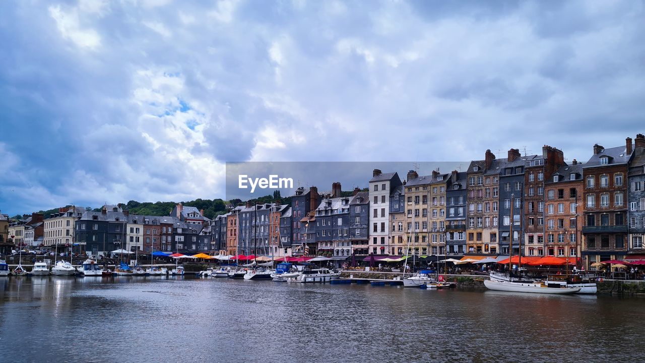 architecture, water, building exterior, built structure, city, sky, cityscape, nautical vessel, transportation, cloud, building, mode of transportation, travel destinations, nature, body of water, harbor, ship, waterway, reflection, travel, waterfront, residential district, sea, town, tourism, vehicle, no people, house, city life, boat, moored, outdoors, landscape, day, canal, multi colored, street