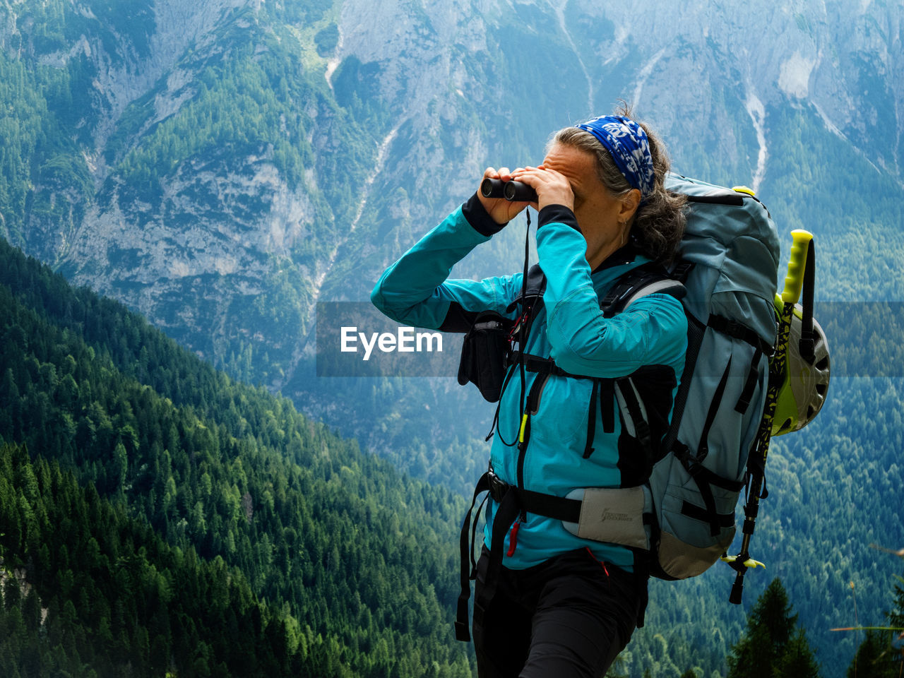 Woman looking through binoculars