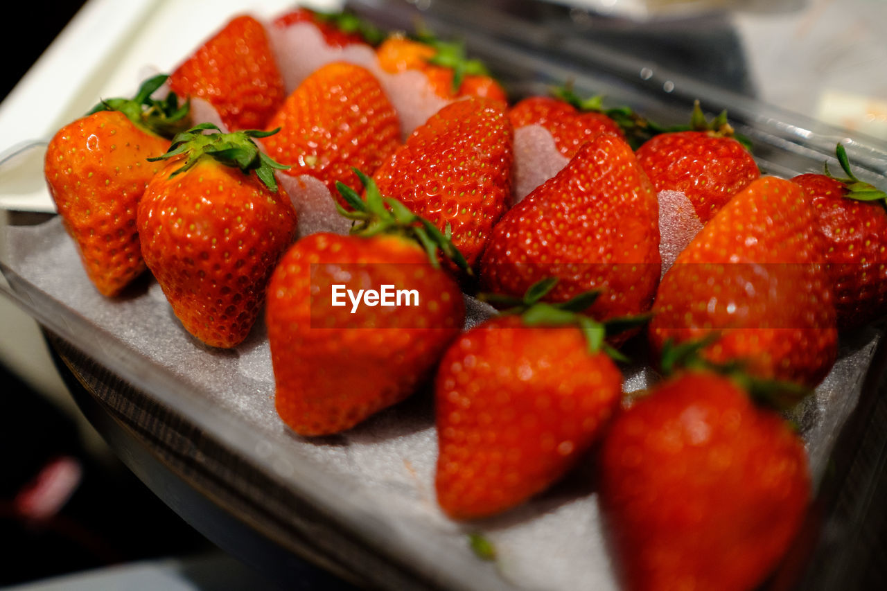 High angle view of strawberries in container