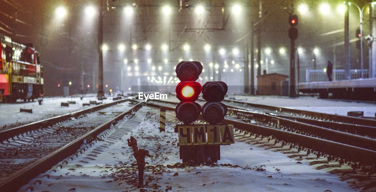 Illuminated railroad tracks during winter