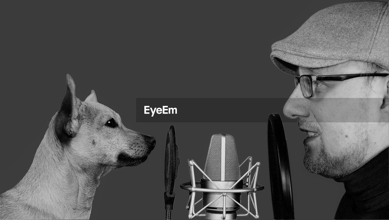 Converstion, a dog a man, a microphone 