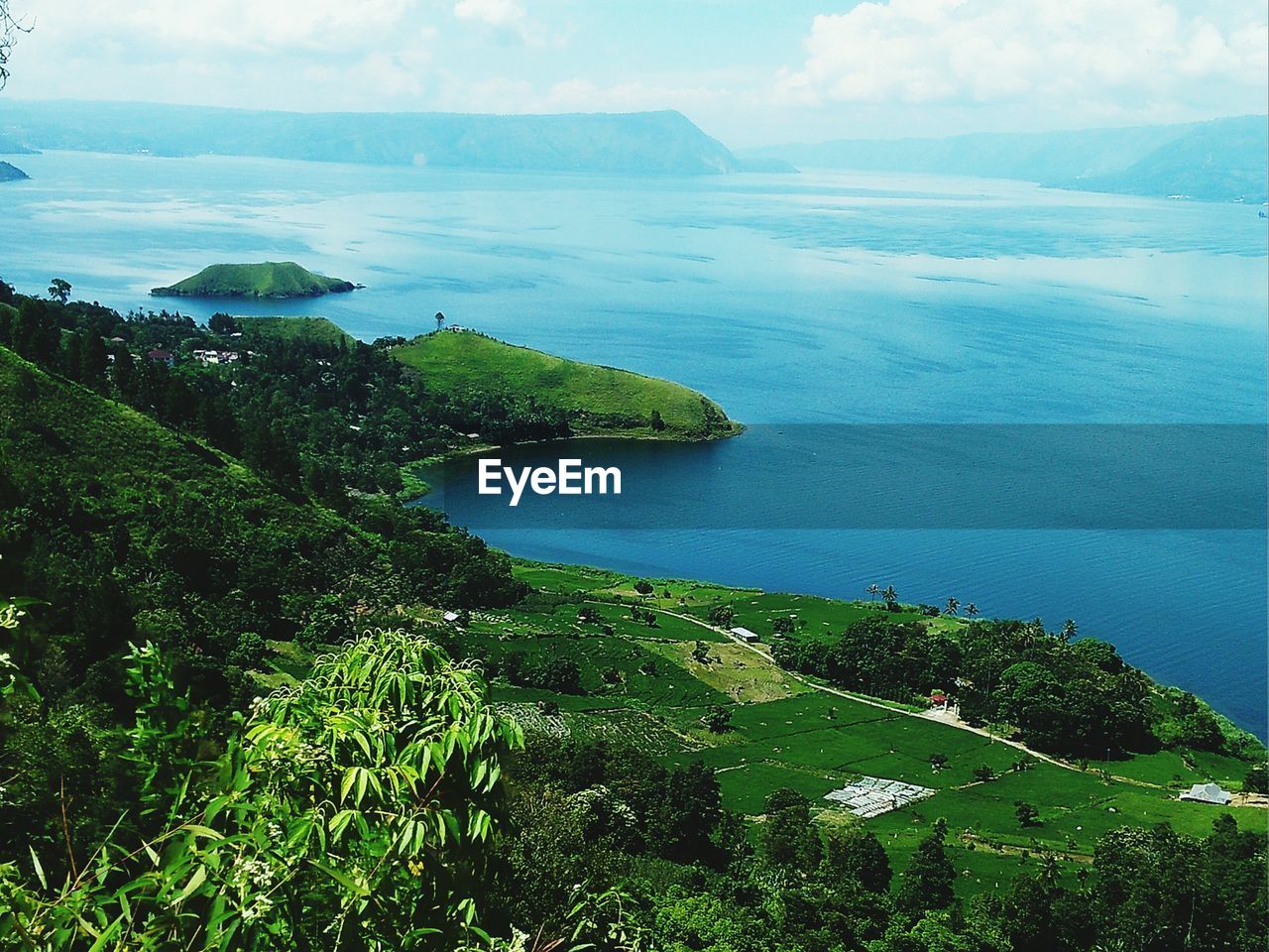 HIGH ANGLE VIEW OF BAY AGAINST CLEAR SKY