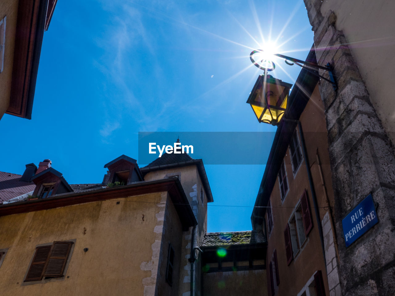 Low angle view of buildings against blue sky