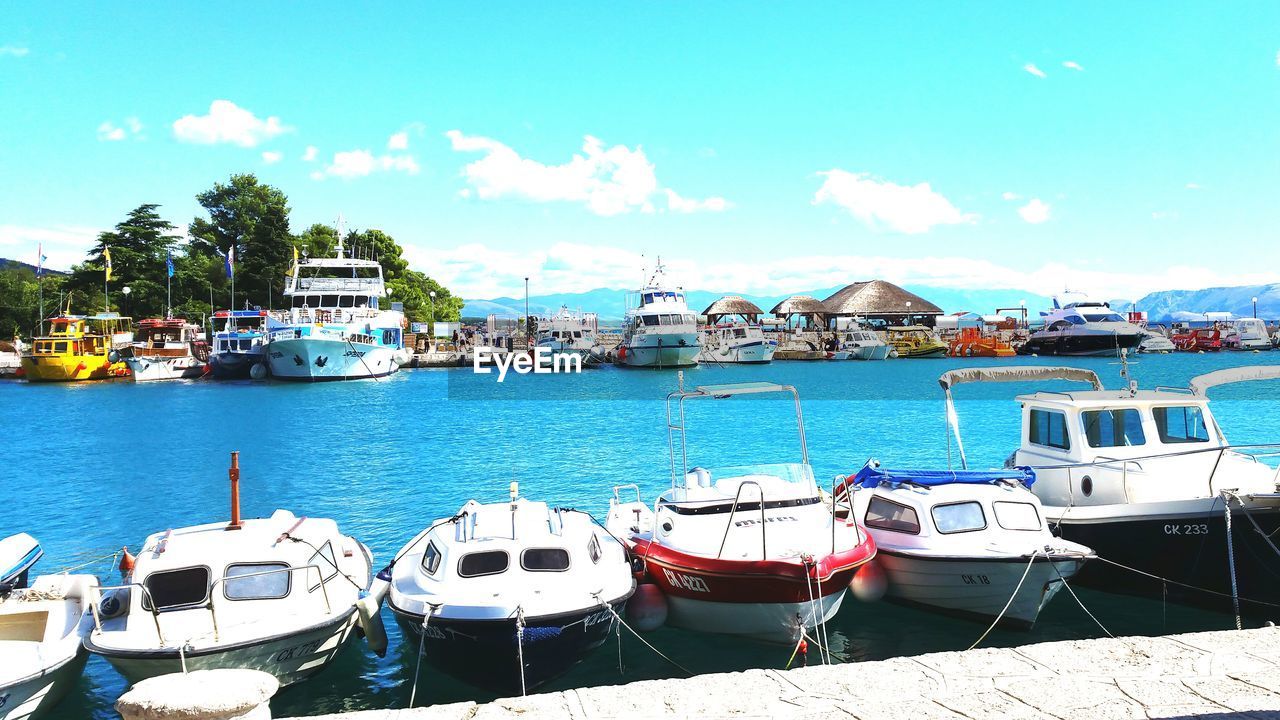 BOATS MOORED ON HARBOR