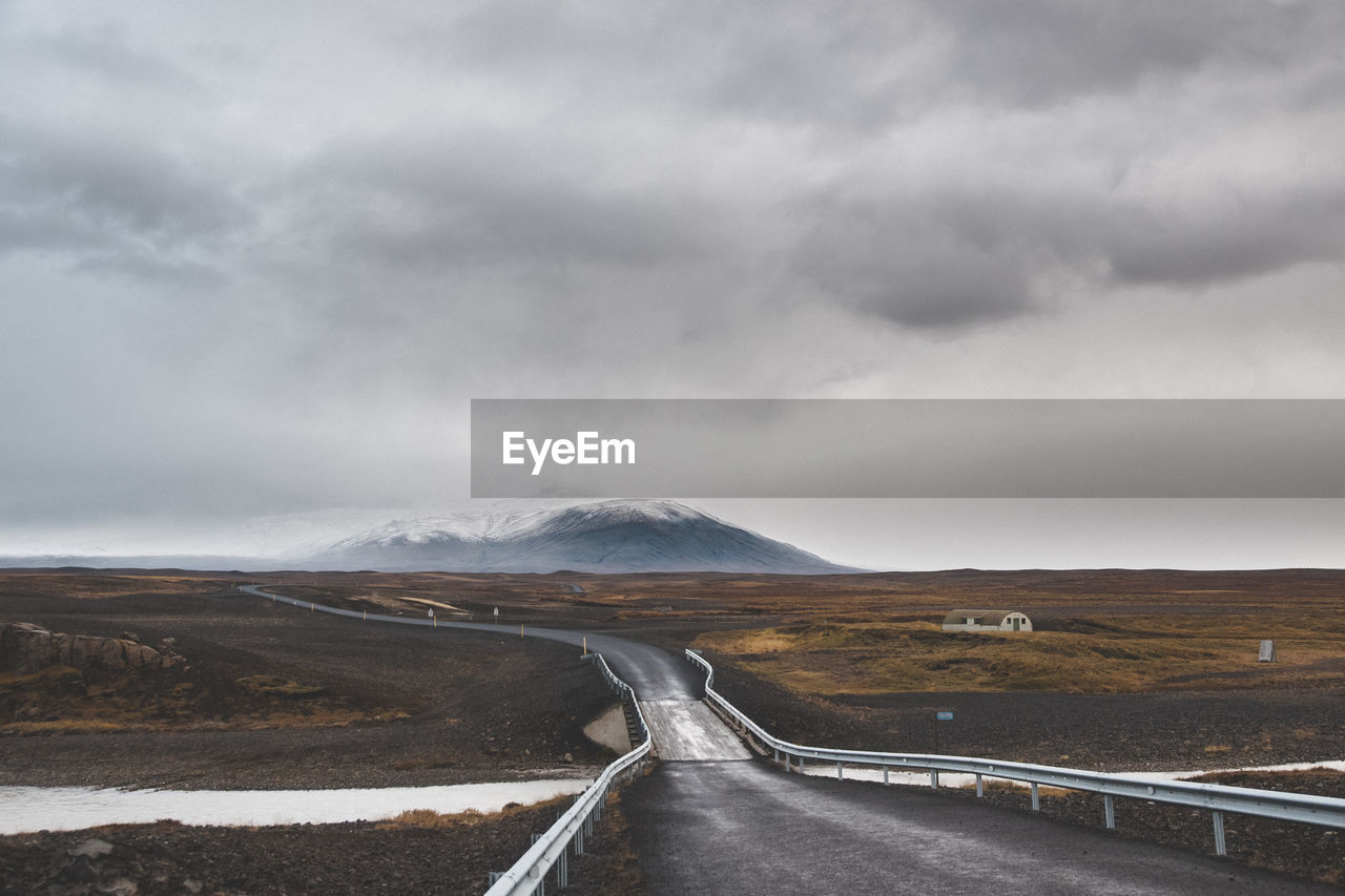 Road amidst landscape against sky