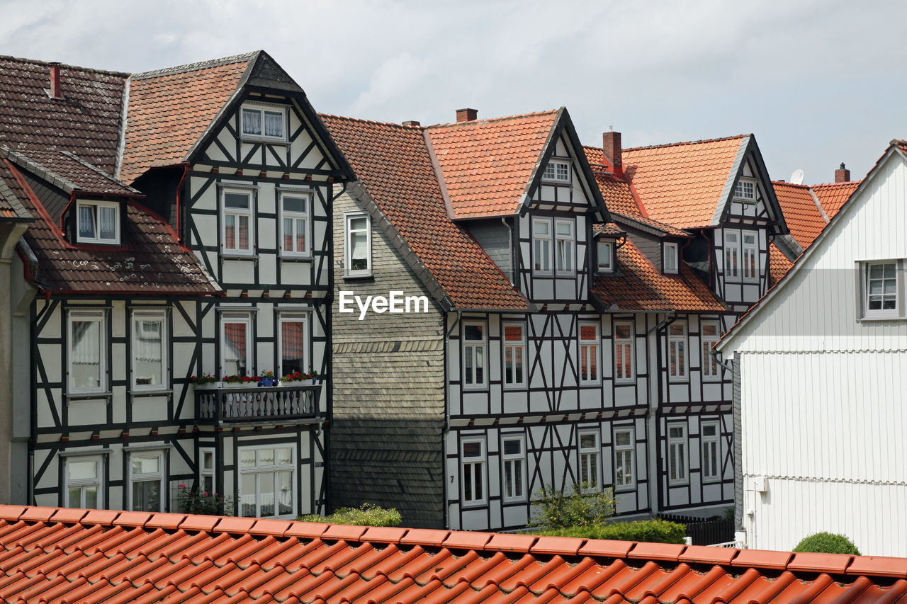 Houses against sky in city