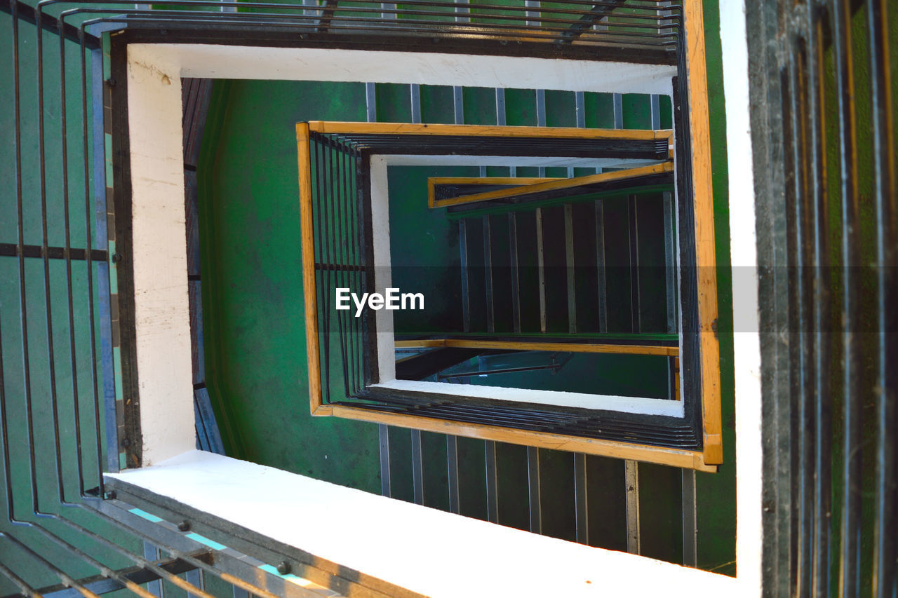 Directly above view of spiral staircase in building