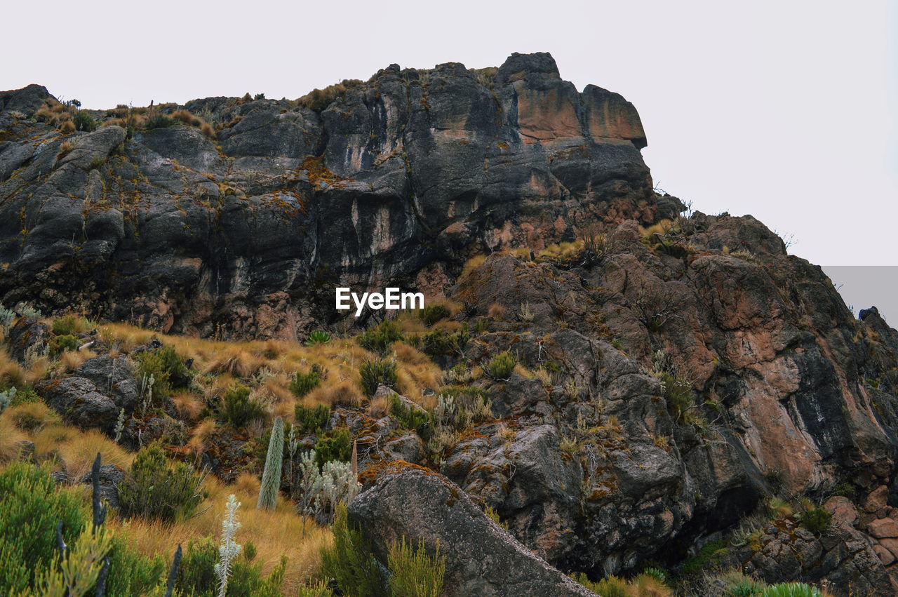 Low angle view of rock formation against sky