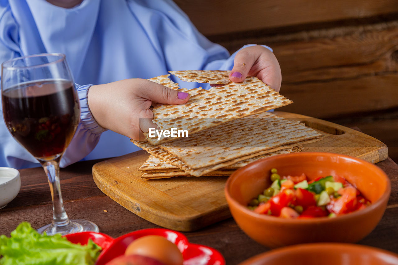 midsection of woman eating food