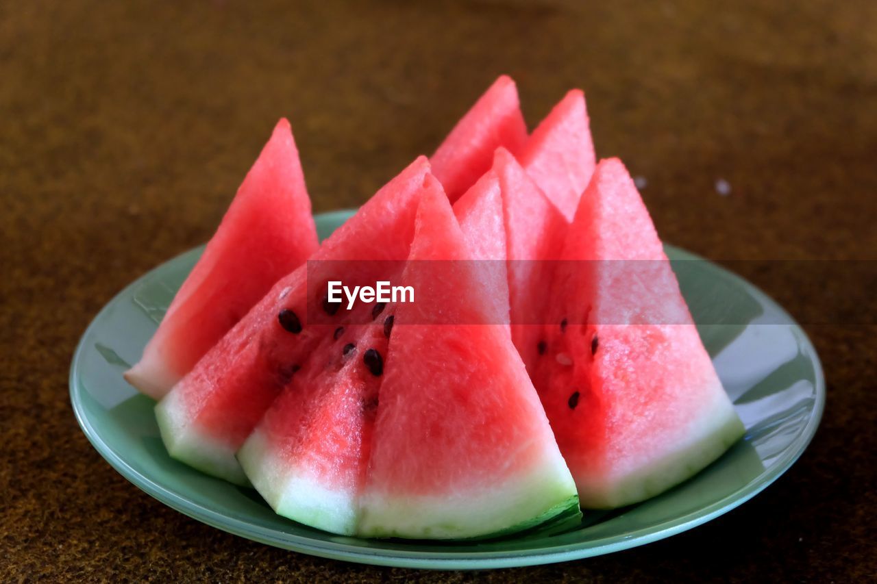 High angle view of fruits in plate on table