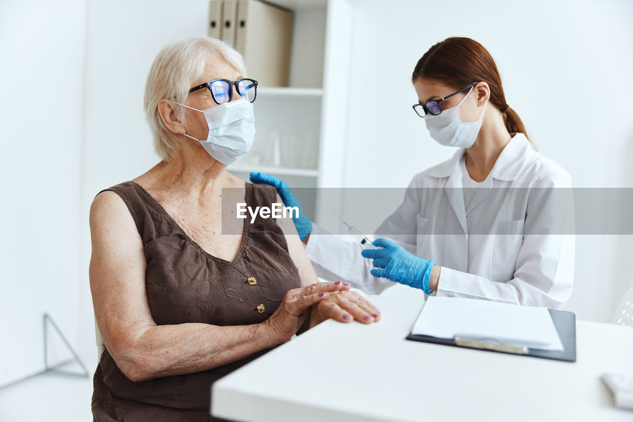 Midsection of woman working in laptop