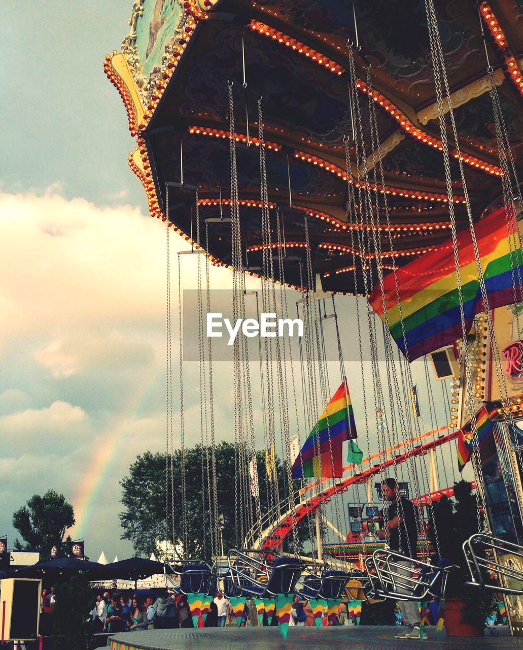 LOW ANGLE VIEW OF CAROUSEL AGAINST SKY